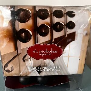 St. Nicholas Square Bronze Bell Stocking Holders